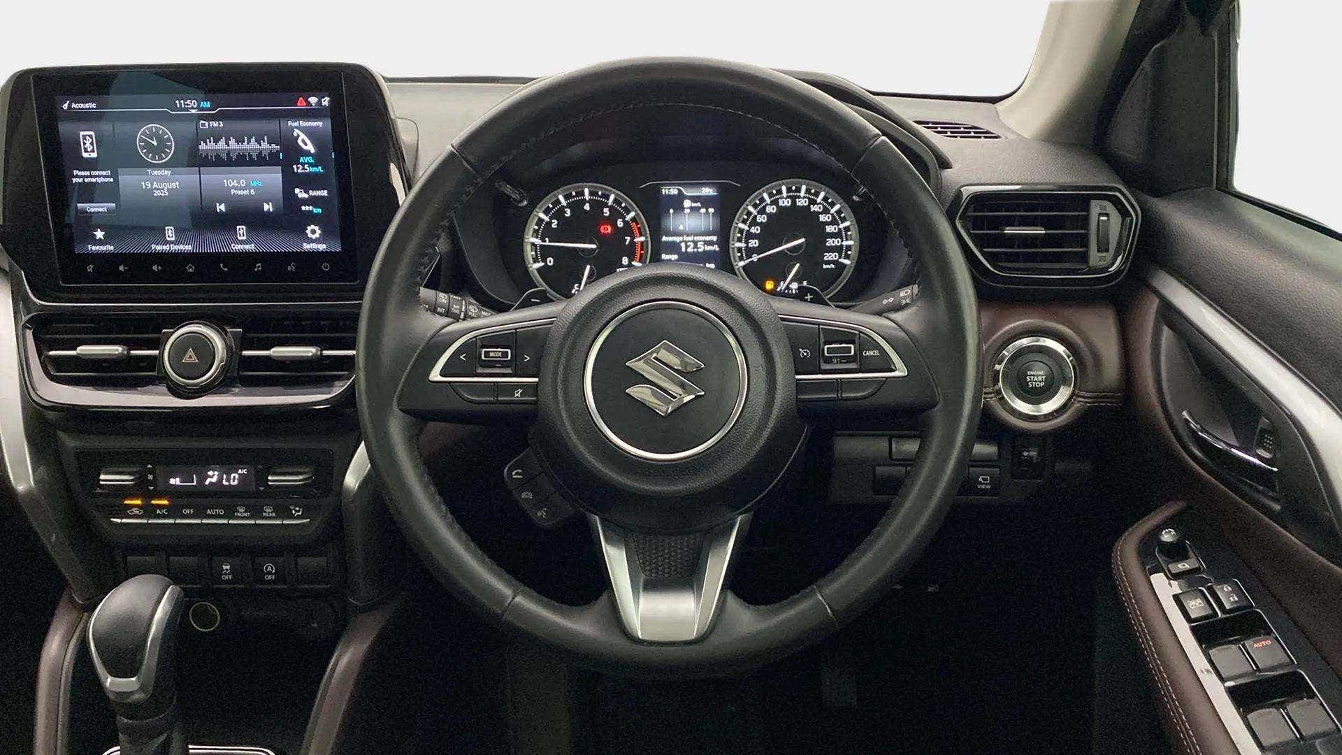 Dashboard and steering wheel of a Maruti Suzuki Grand Vitara
