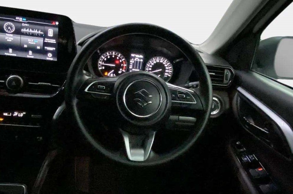 Interior dashboard and steering wheel of a Maruti Suzuki Grand Vitara