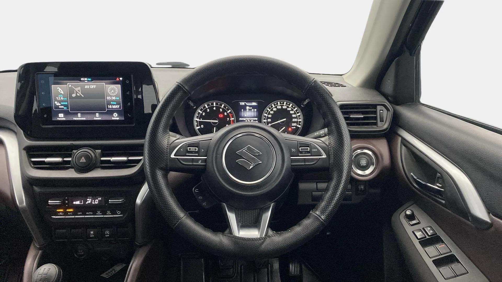 Interior dashboard view of a Maruti Suzuki Grand Vitara