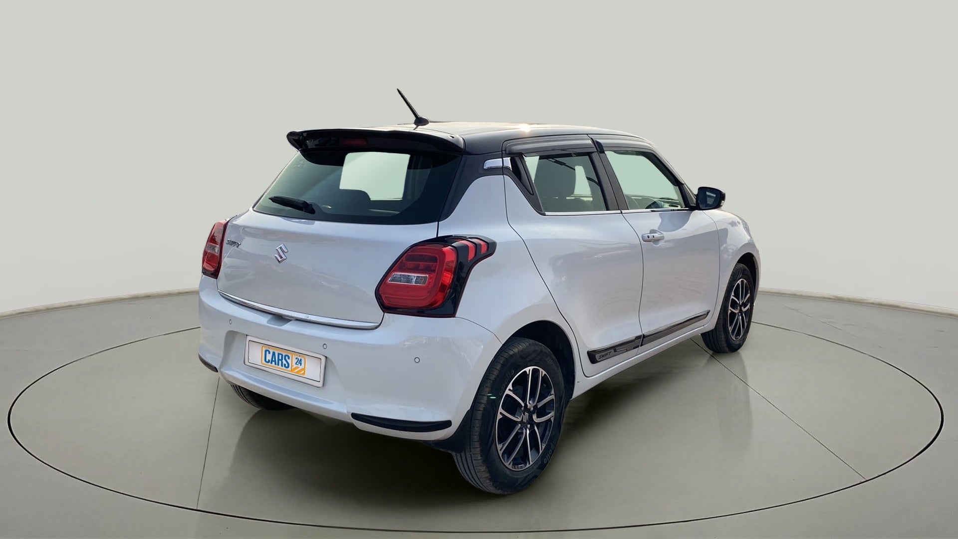 Rear three-quarter view of a maruti suzuki swift 2021 - 2023