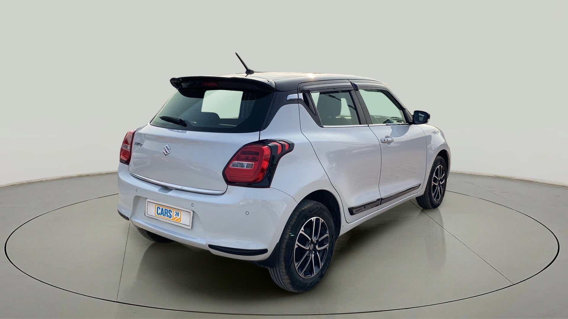 Rear three-quarter view of a maruti suzuki swift 2021 - 2023