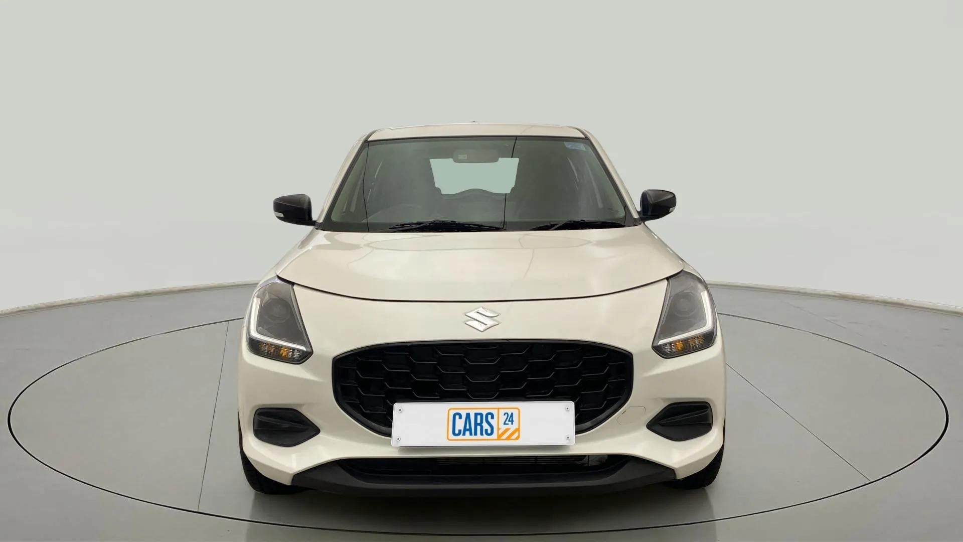 Front view of a Pearl Arctic White with Pearl Midnight Black Maruti Suzuki Swift