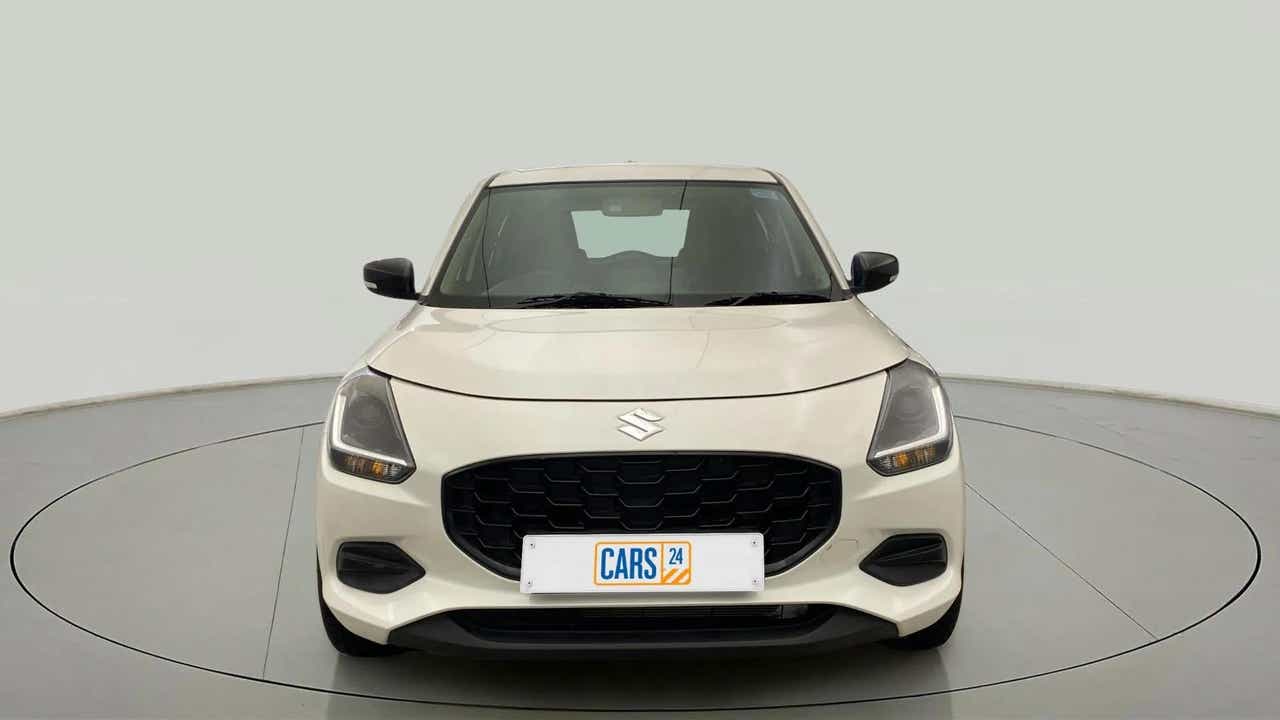 Front view of a Pearl Arctic White with Pearl Midnight Black Maruti Suzuki Swift