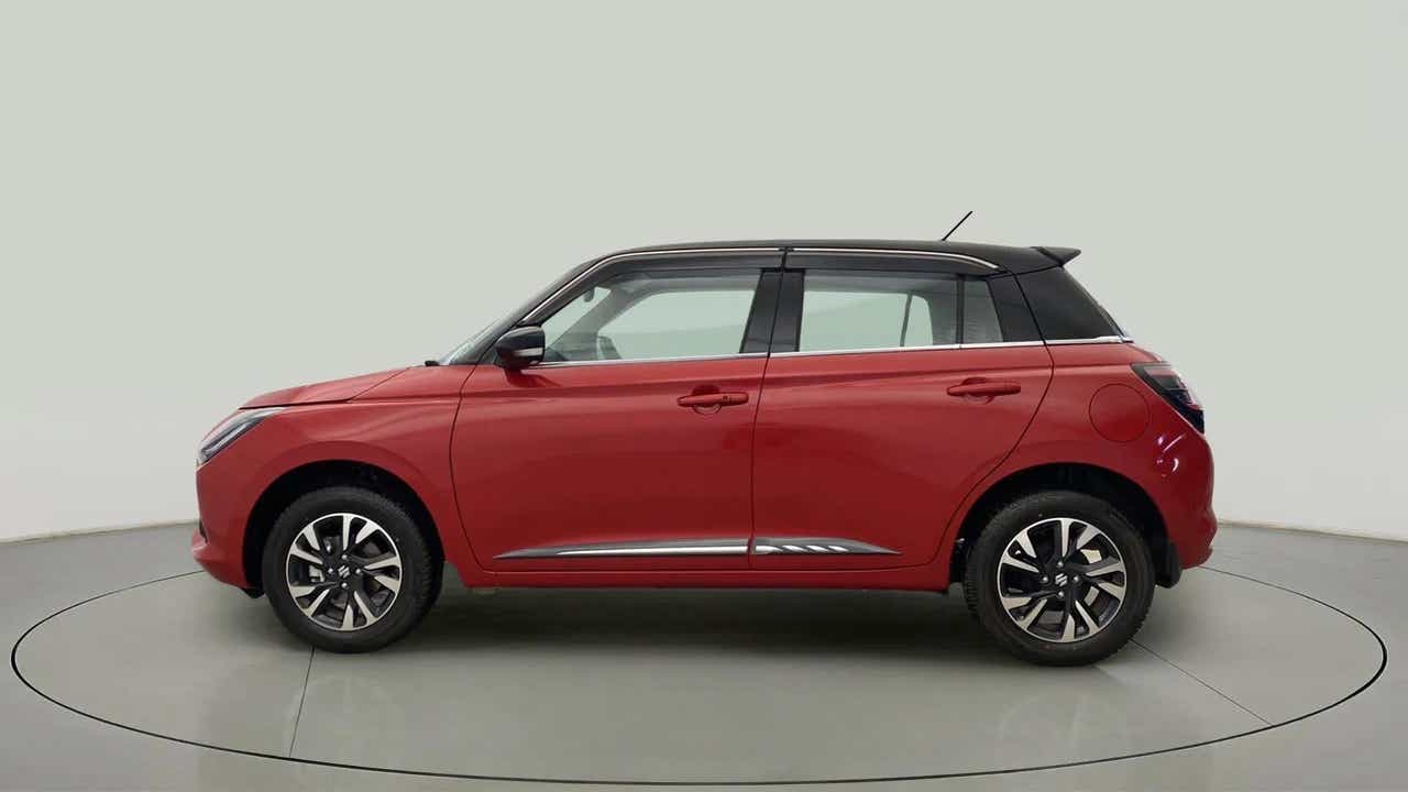 Side profile of a Sizzling Red with Midnight Black Maruti Suzuki Swift