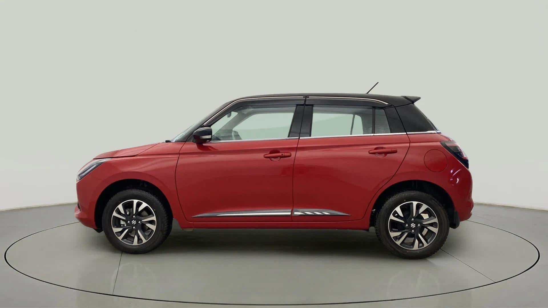 Side profile of a Sizzling Red with Midnight Black Maruti Suzuki Swift