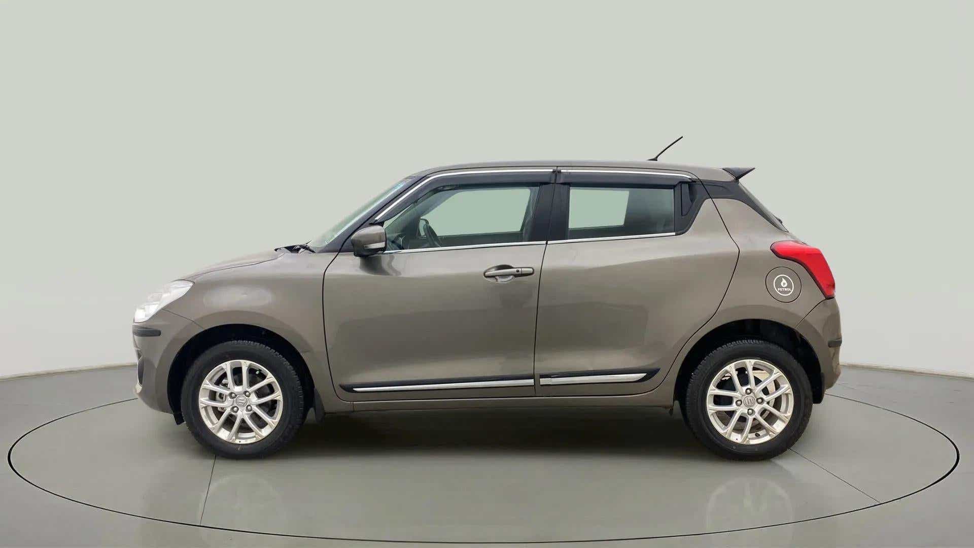 Side view of a Maruti Suzuki Swift 2021 - 2023