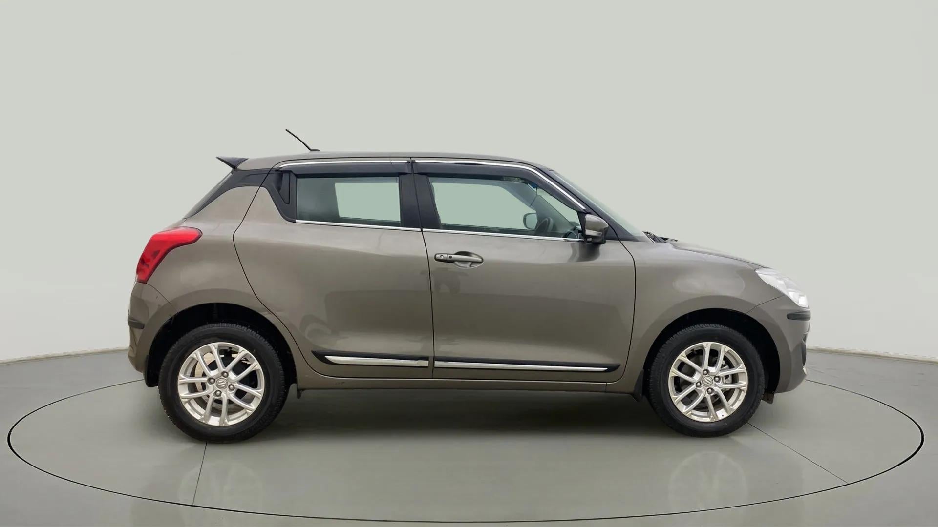 Side view of a Maruti Suzuki Swift 2021 - 2023