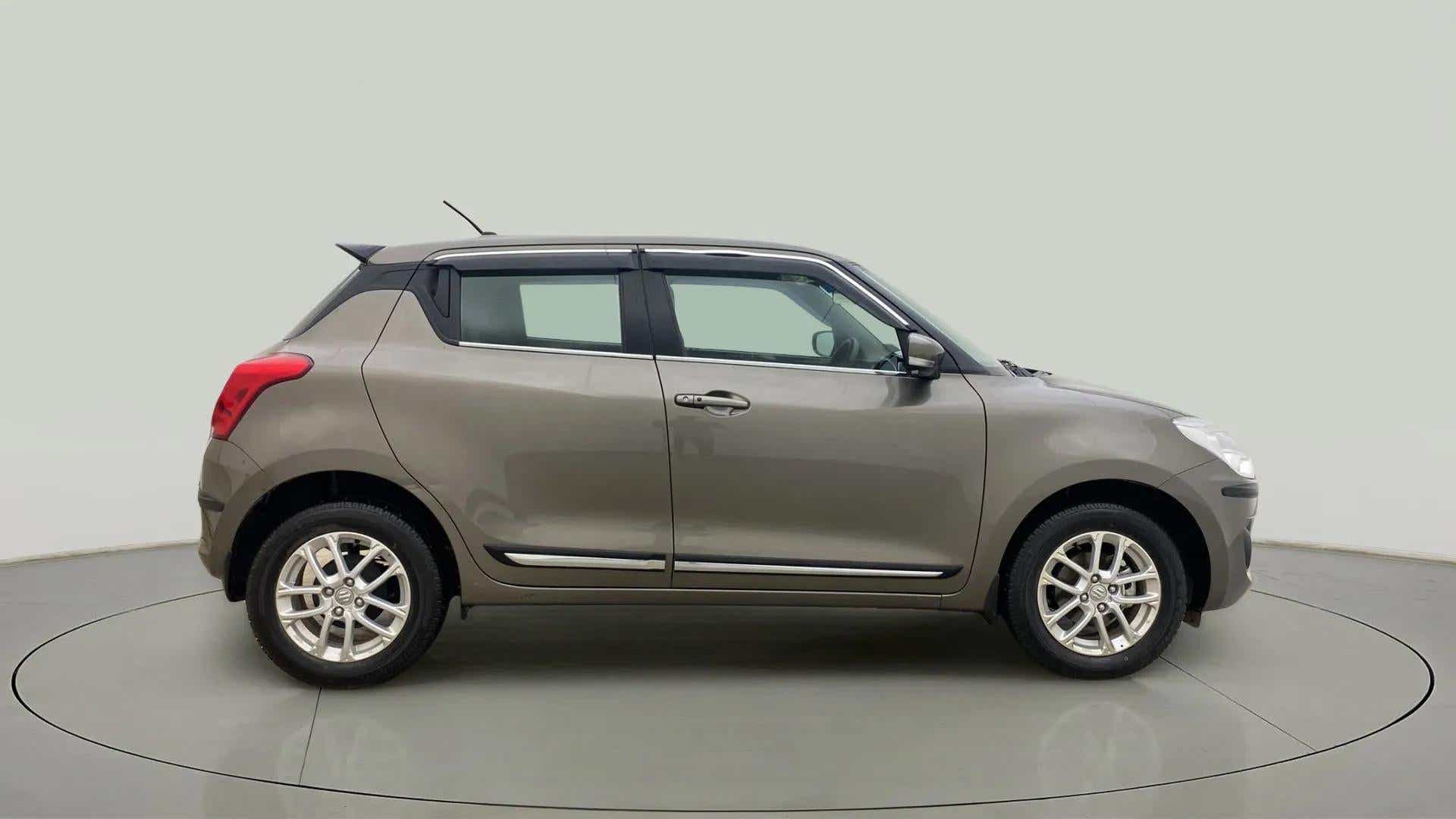 Side view of a Maruti Suzuki Swift 2021 - 2023