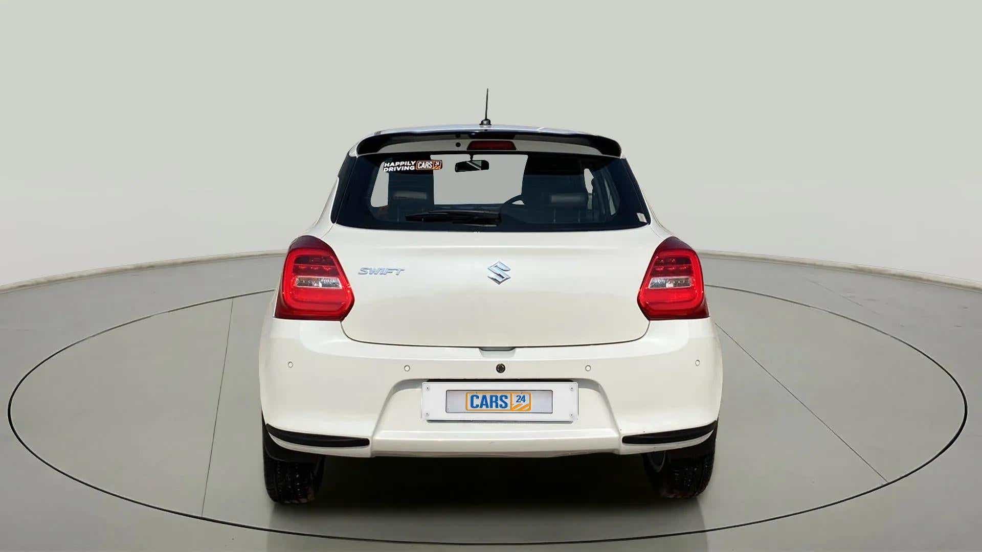 Rear view of a Pearl Arctic White with Pearl Midnight Black Maruti Suzuki Swift