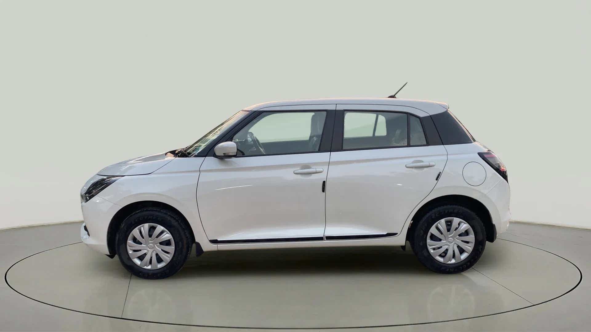 Side view of a Pearl Arctic White with Pearl Midnight Black Maruti Suzuki Swift