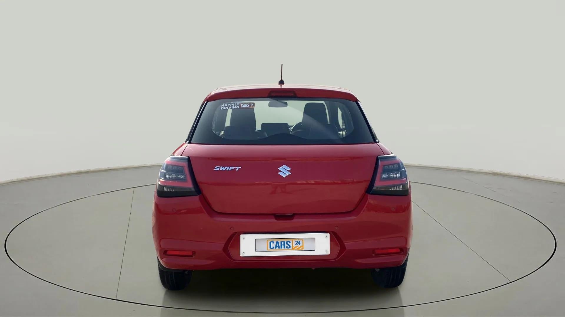 Rear view of a sizzling red Maruti Suzuki Swift