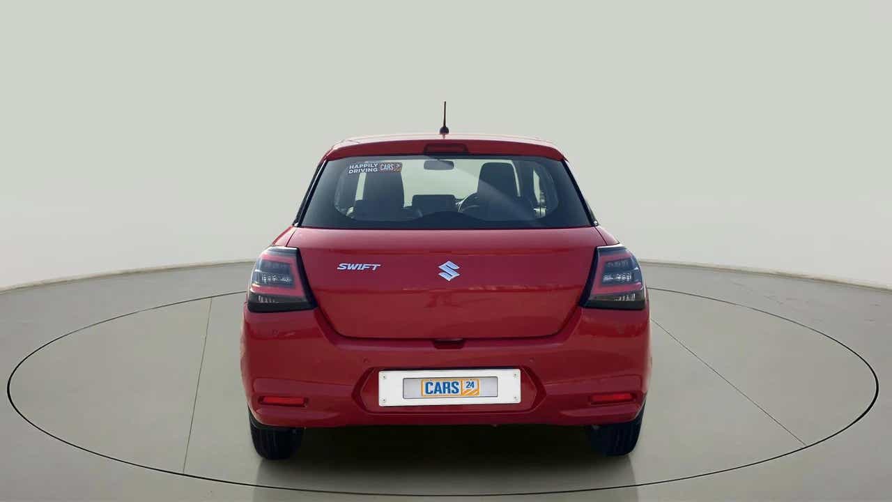 Rear view of a sizzling red Maruti Suzuki Swift
