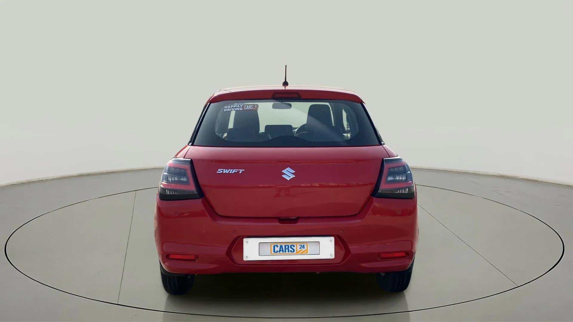 Rear view of a sizzling red Maruti Suzuki Swift