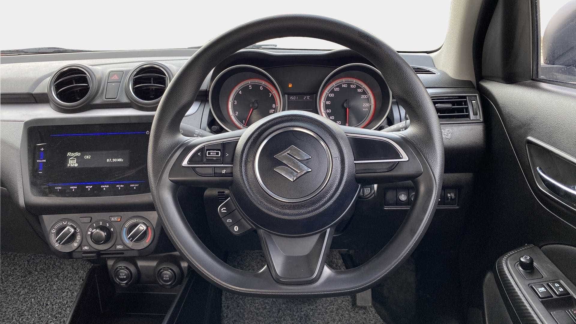 Dashboard and steering wheel view of a Maruti Suzuki Swift 2021 - 2023