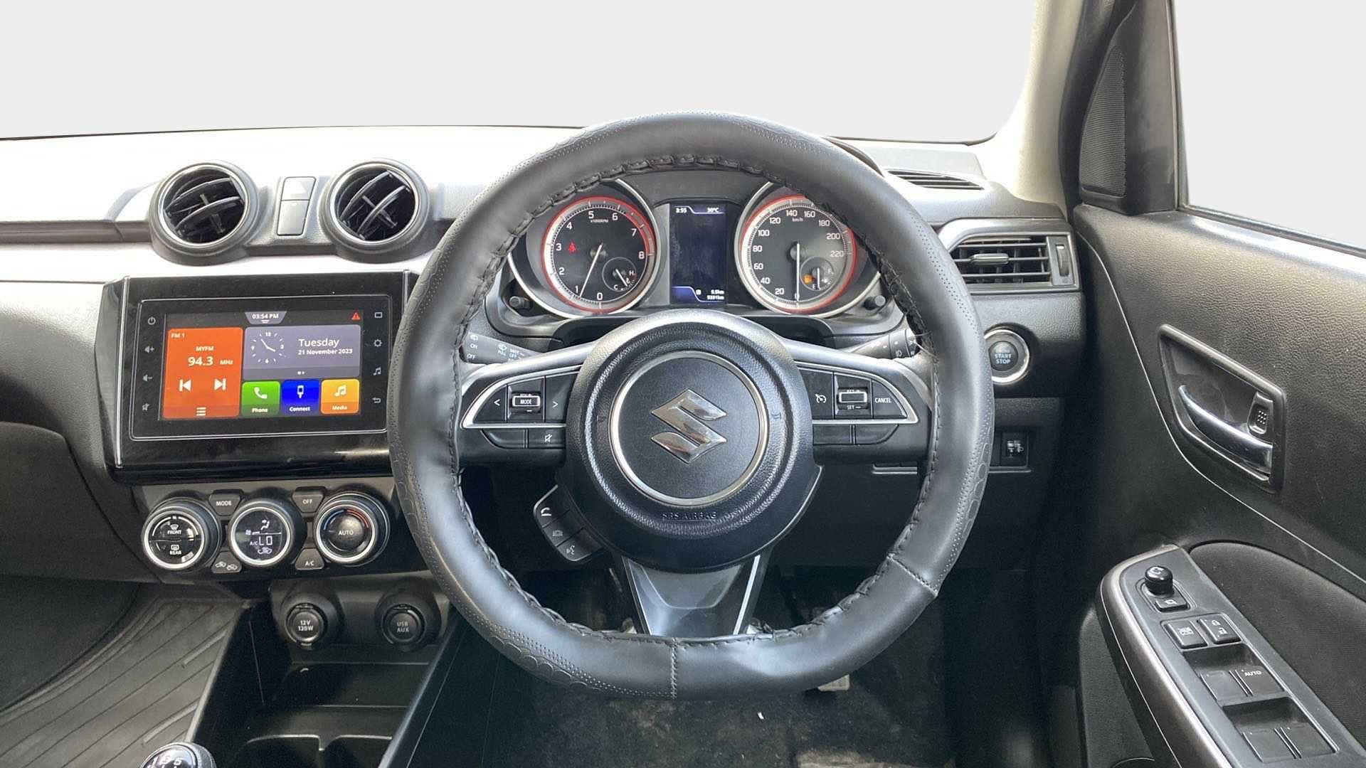 Dashboard and steering wheel view of a Maruti Suzuki Swift 2021 - 2023