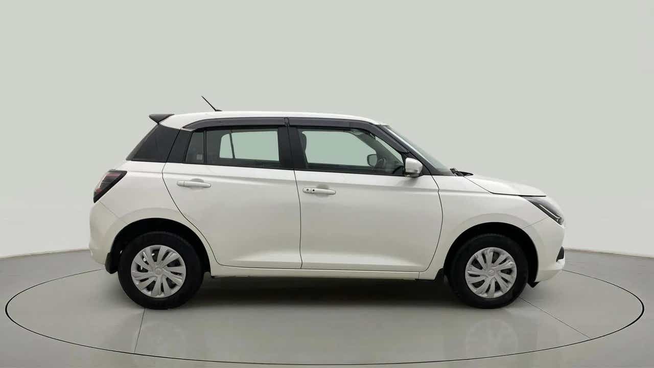 Side view of a Pearl Arctic White with Pearl Midnight Black Maruti Suzuki Swift