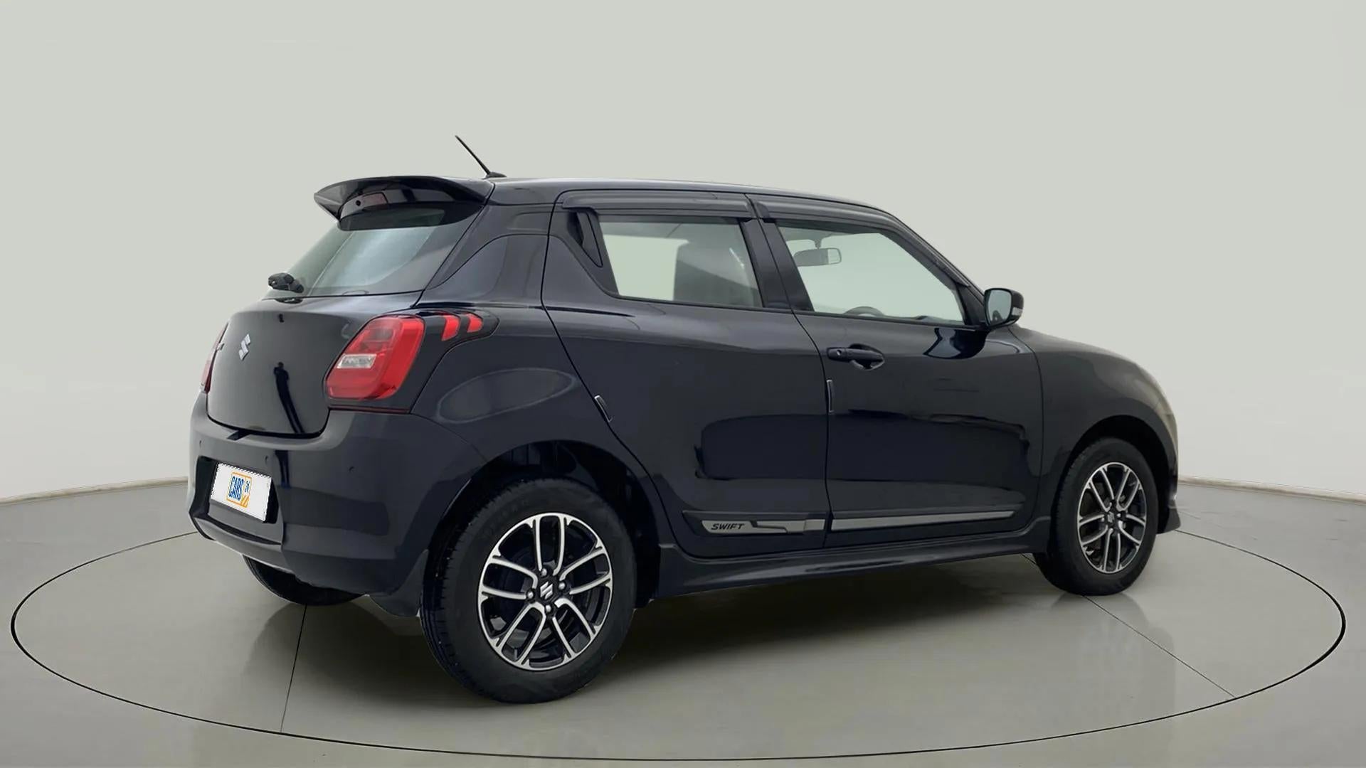 Rear three-quarter view of a Maruti Suzuki Swift
