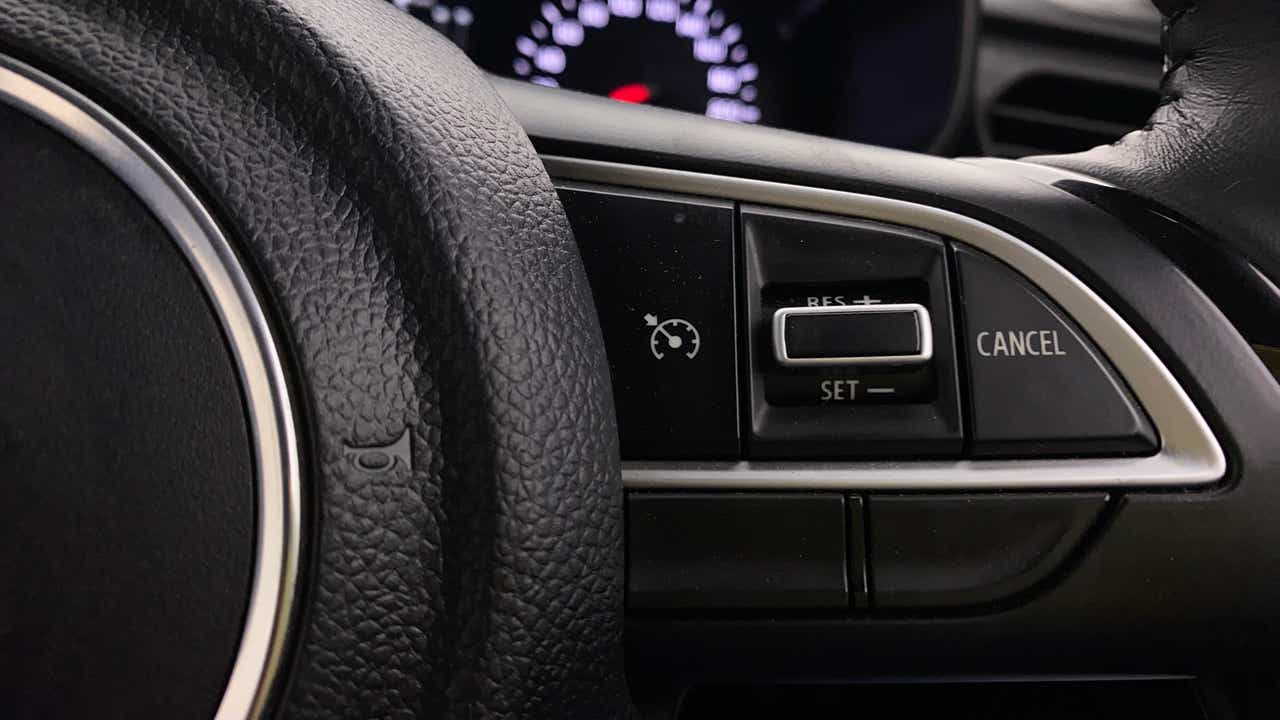 Steering wheel cruise control buttons of a Maruti Suzuki Swift
