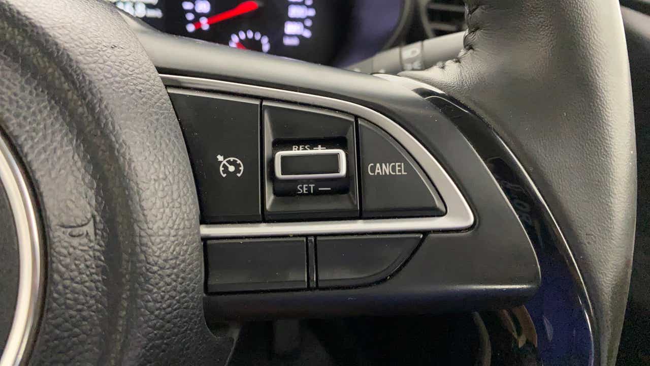 Steering wheel cruise control buttons of a Maruti Suzuki Swift