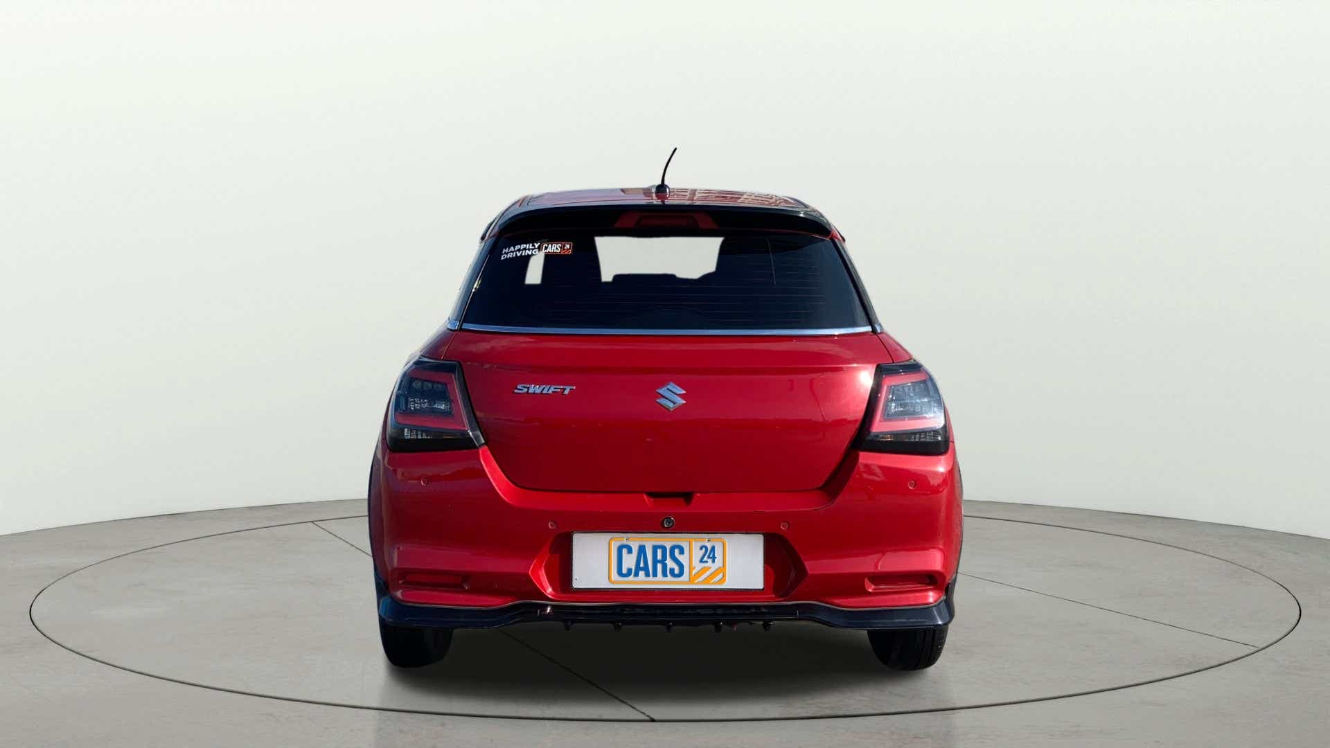 Rear view of a Sizzling Red Maruti Suzuki Swift