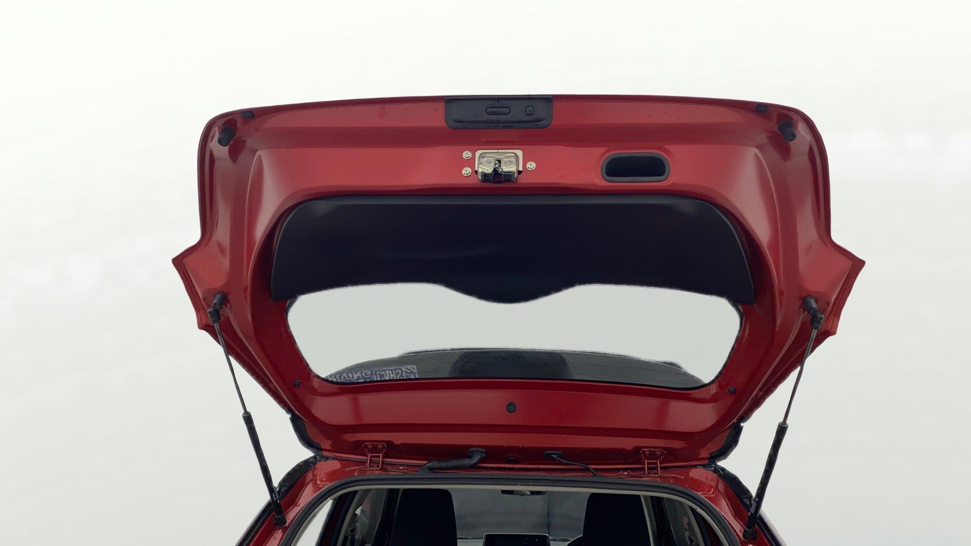 Open tailgate view of a Maruti Suzuki Swift