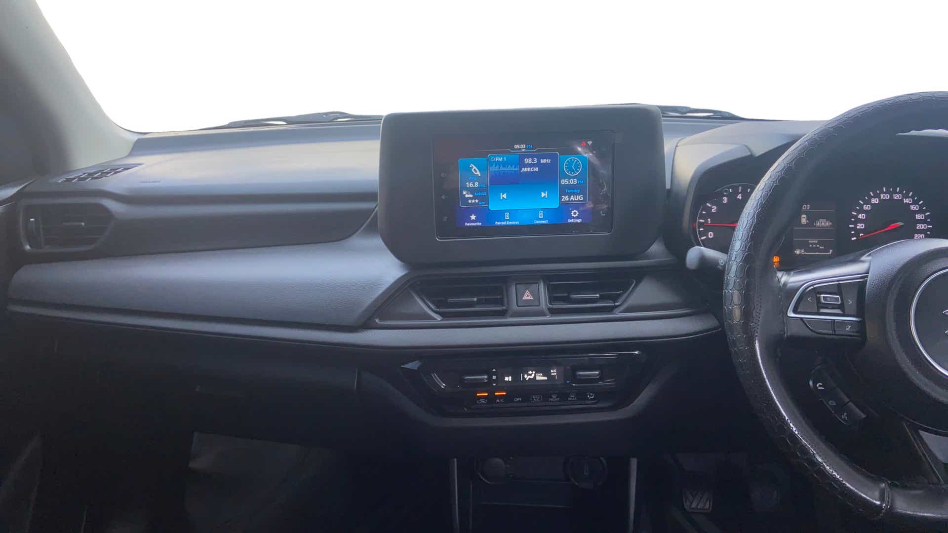 Dashboard and steering wheel of a Maruti Suzuki Swift