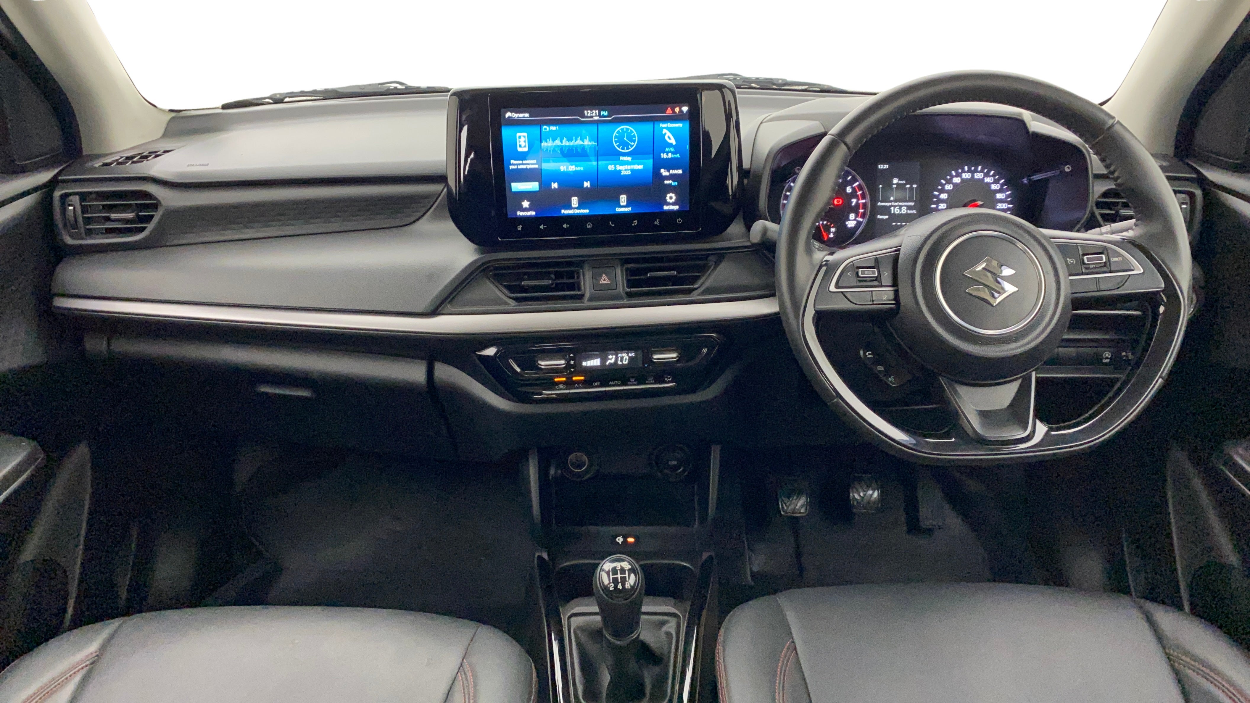 Dashboard and steering view of a Maruti Suzuki Swift