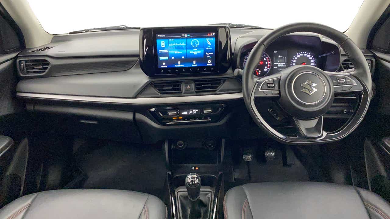 Dashboard and steering view of a Maruti Suzuki Swift