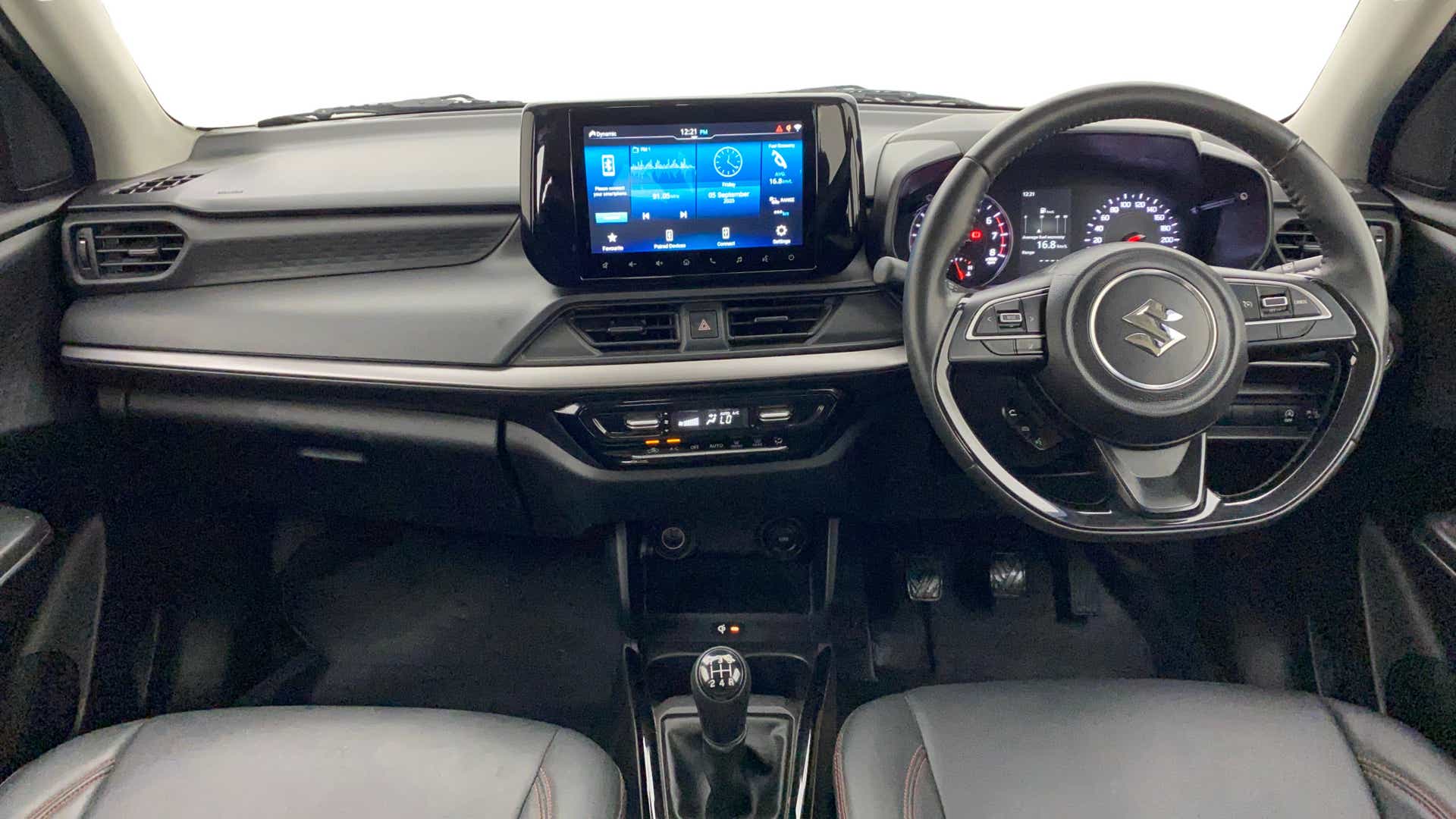 Dashboard and steering view of a Maruti Suzuki Swift