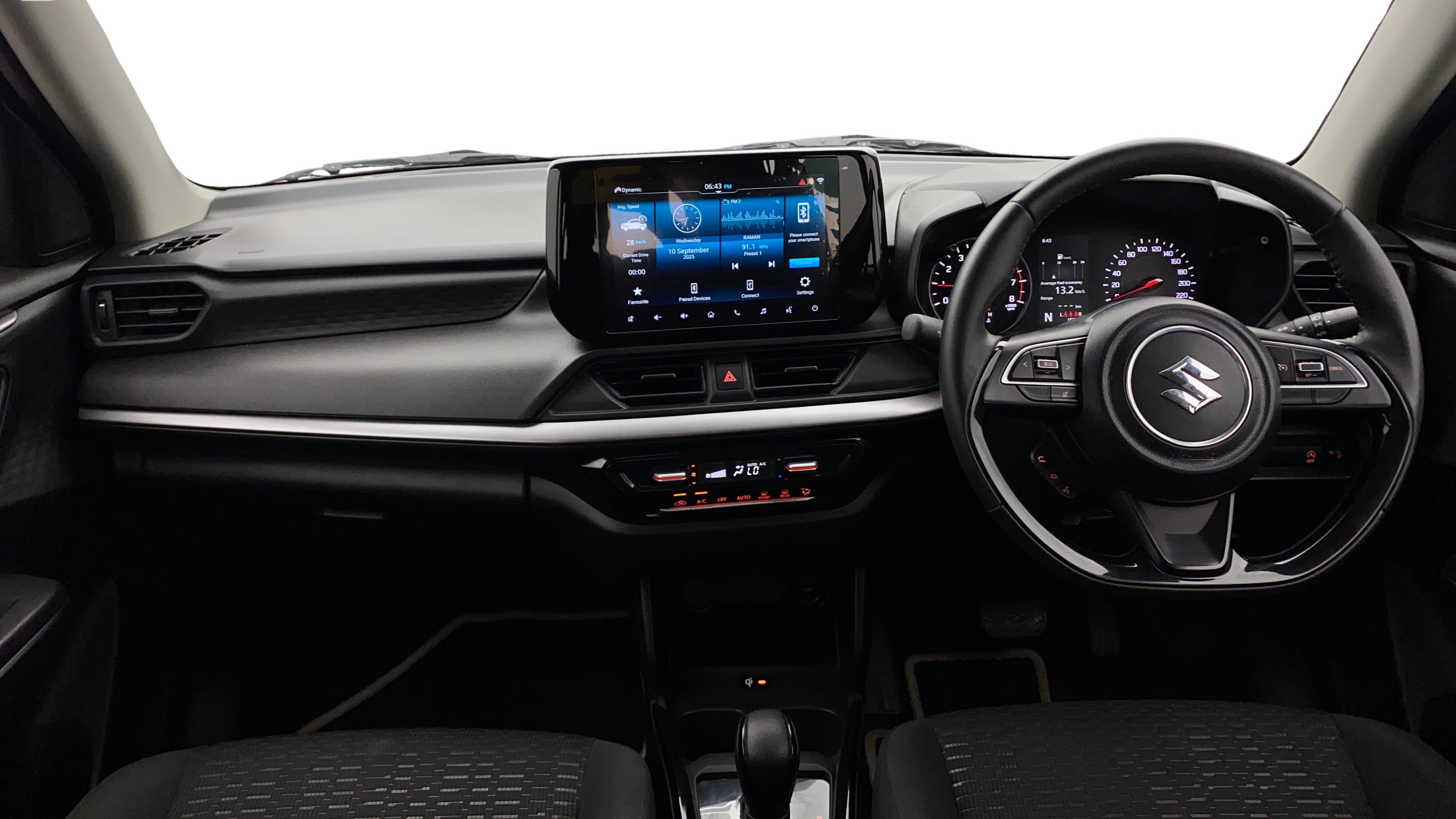 Dashboard and steering wheel of a Maruti Suzuki Swift