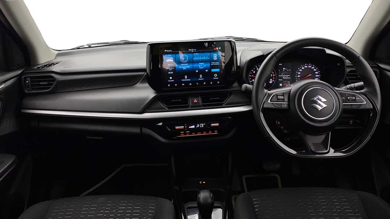 Dashboard and steering wheel of a Maruti Suzuki Swift