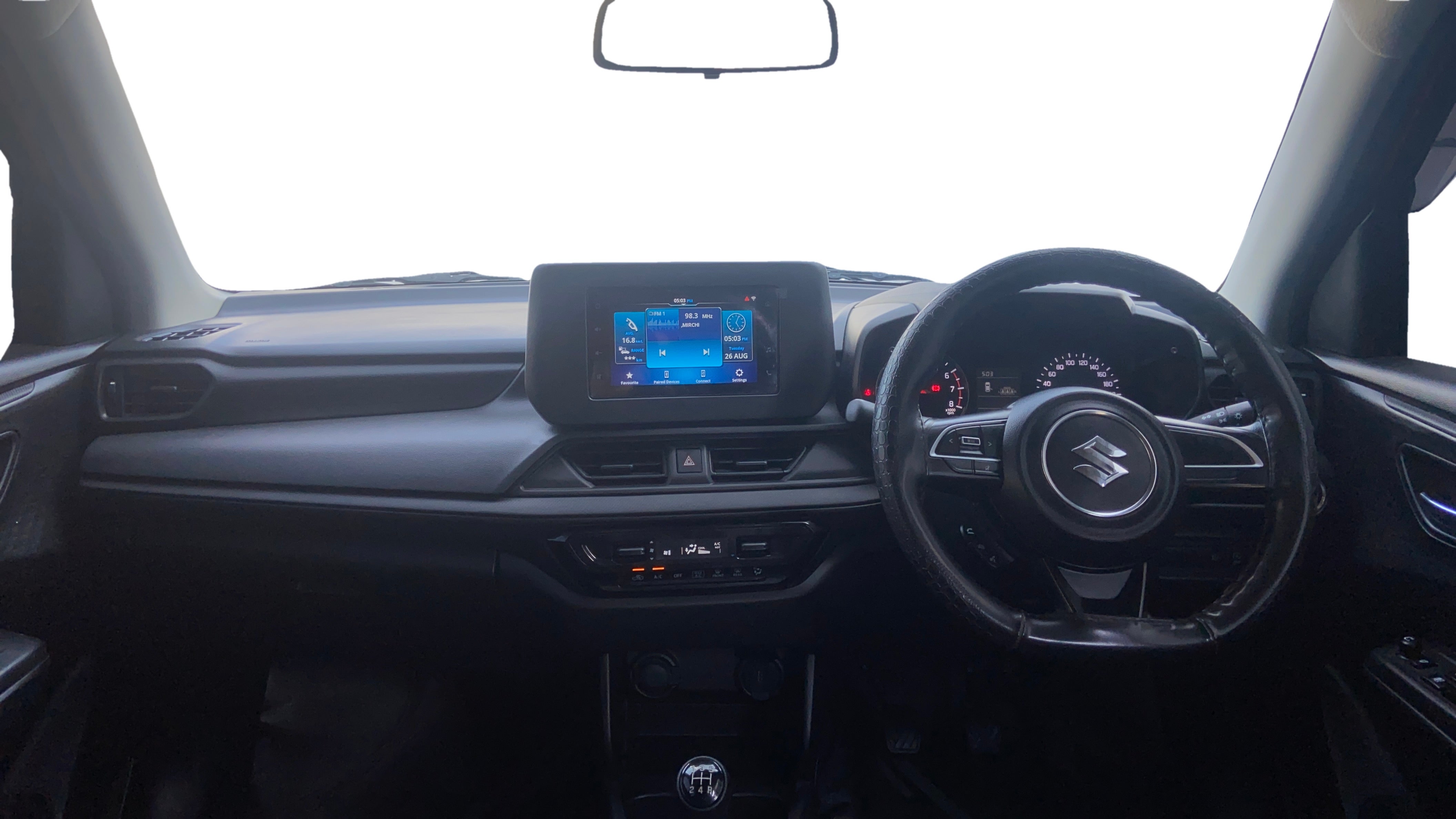 Interior dashboard view of a Maruti Suzuki Swift