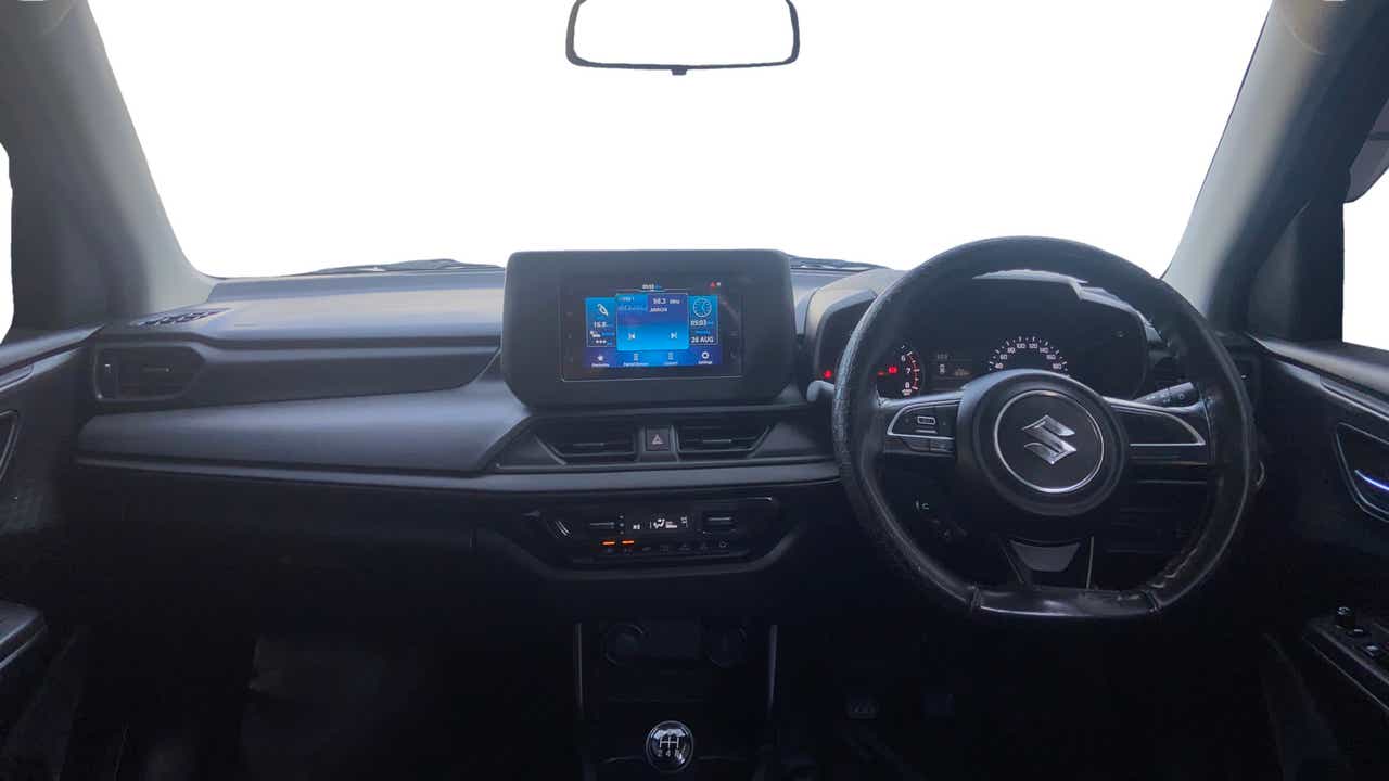 Interior dashboard view of a Maruti Suzuki Swift
