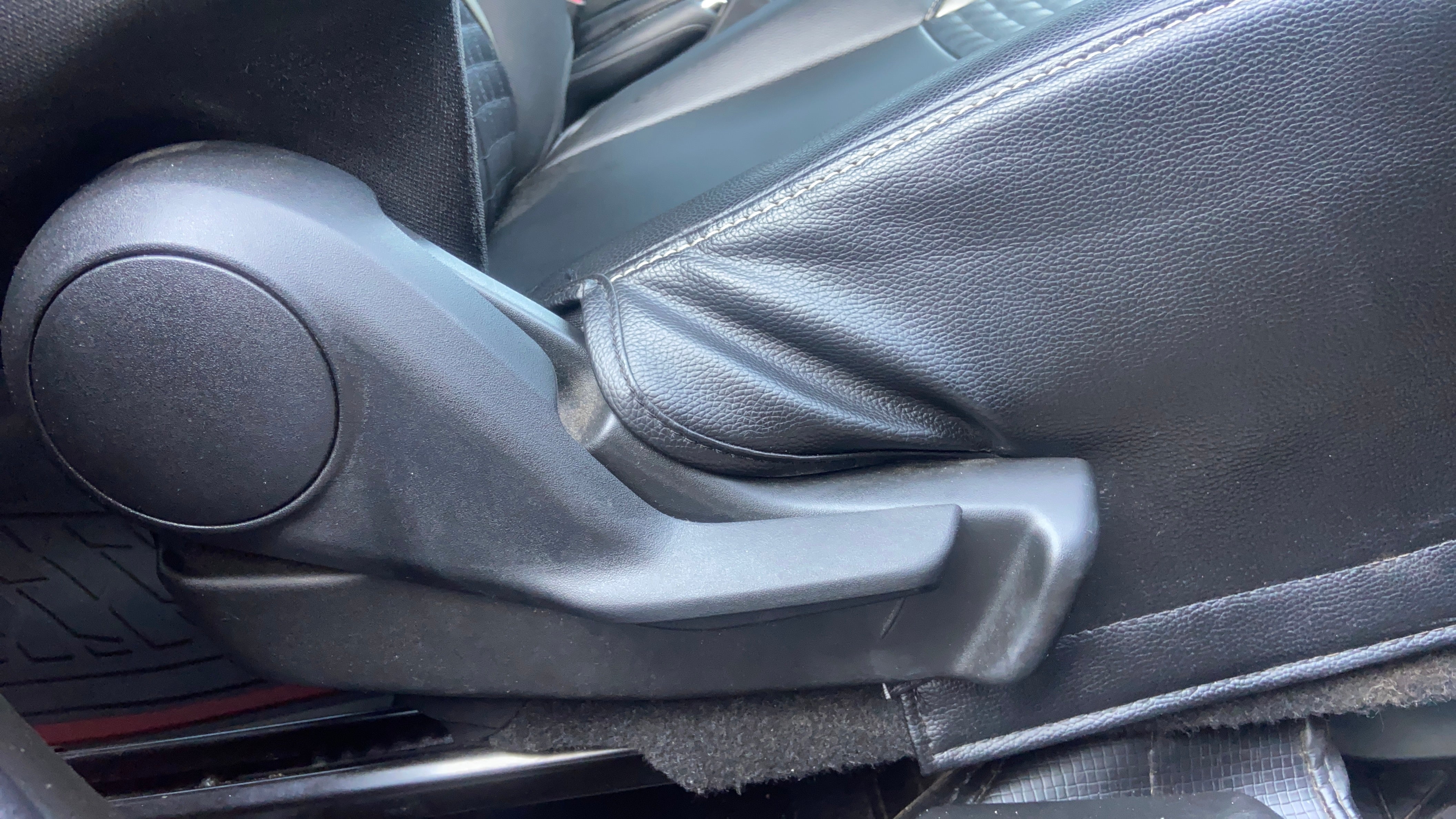 Seat adjustment lever of a Maruti Suzuki Swift