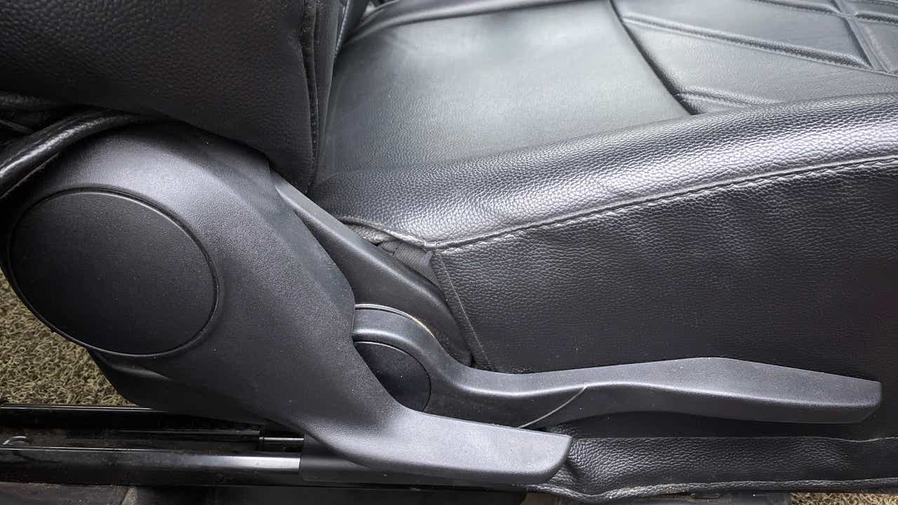 Close-up of the driver's seat side lever of a Maruti Suzuki Swift 2021 - 2023