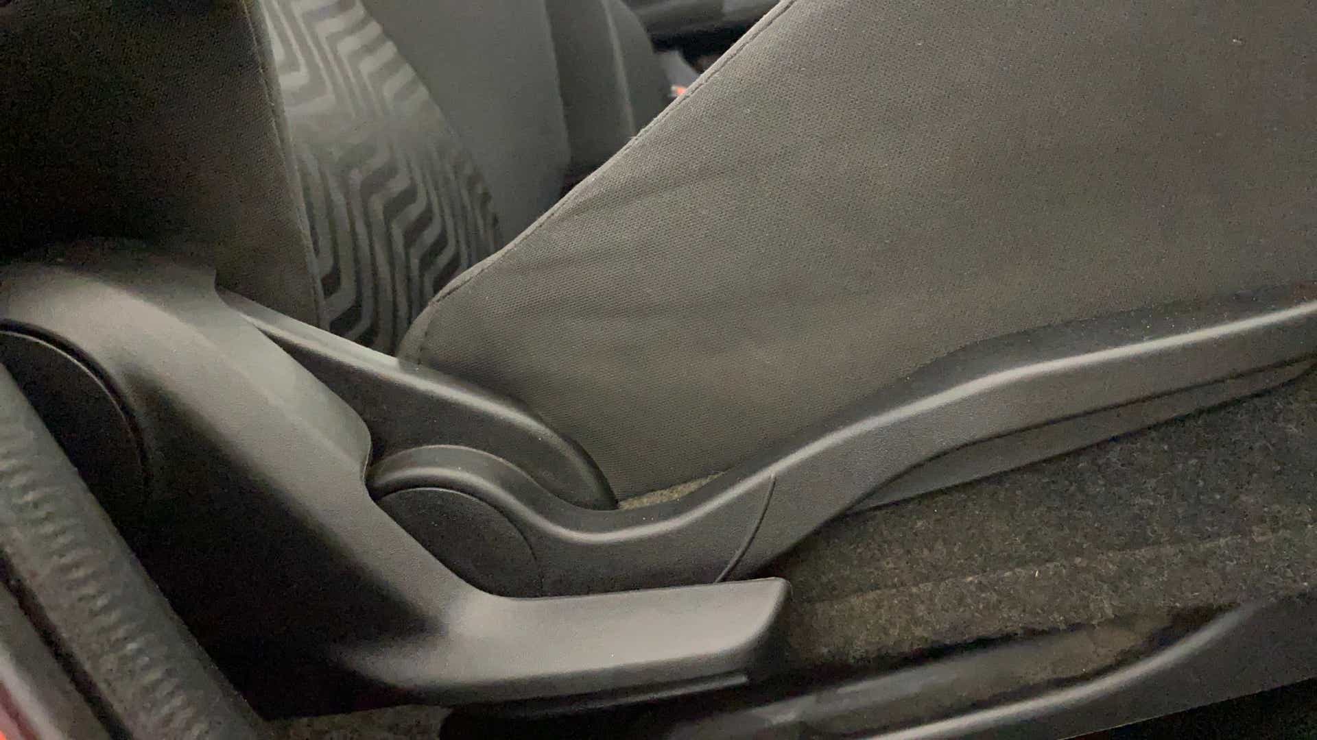 Close-up of the seat adjustment lever of a Maruti Suzuki Swift 2021 - 2023