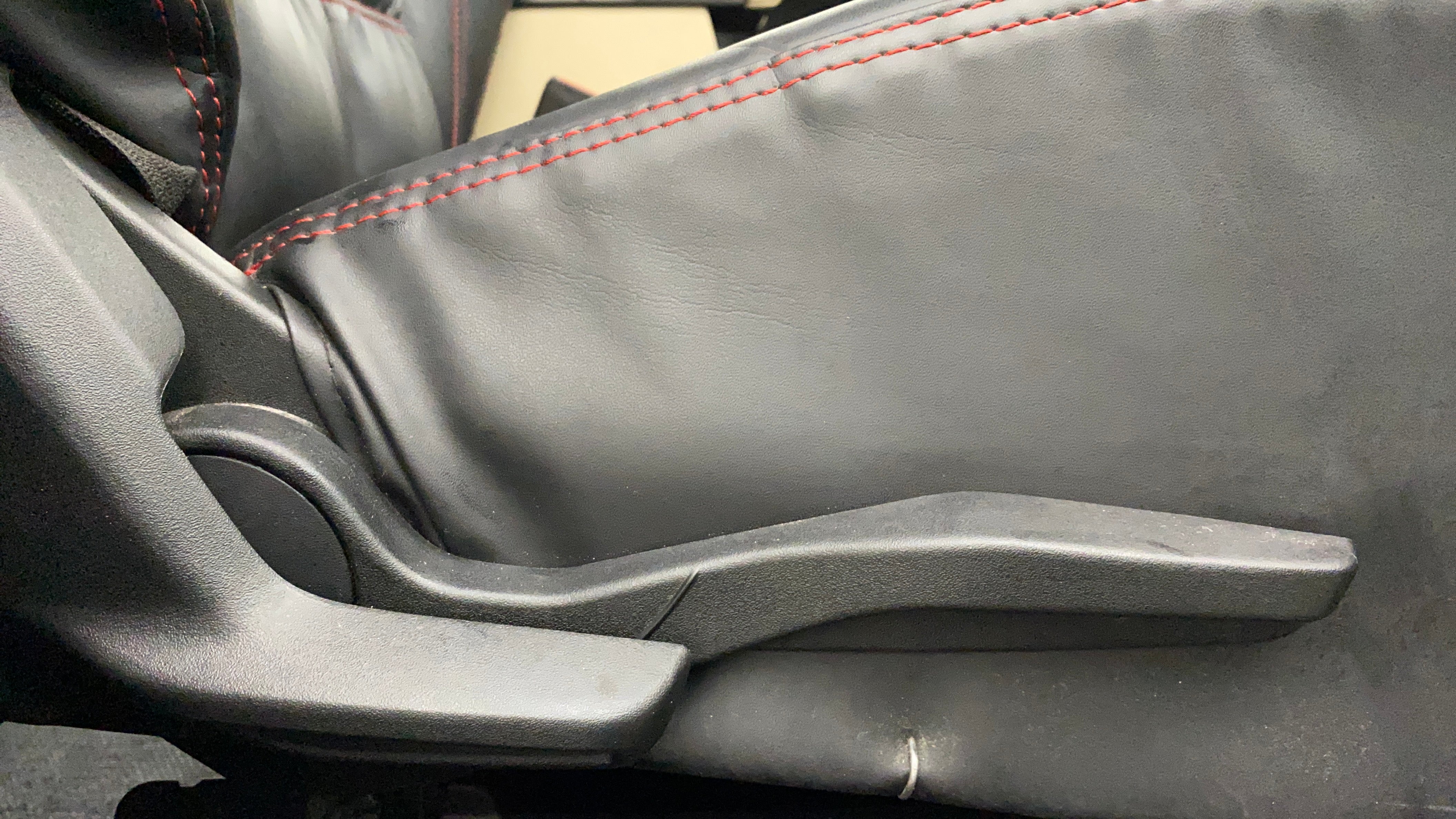 Seat height adjuster lever of a Maruti Suzuki Swift