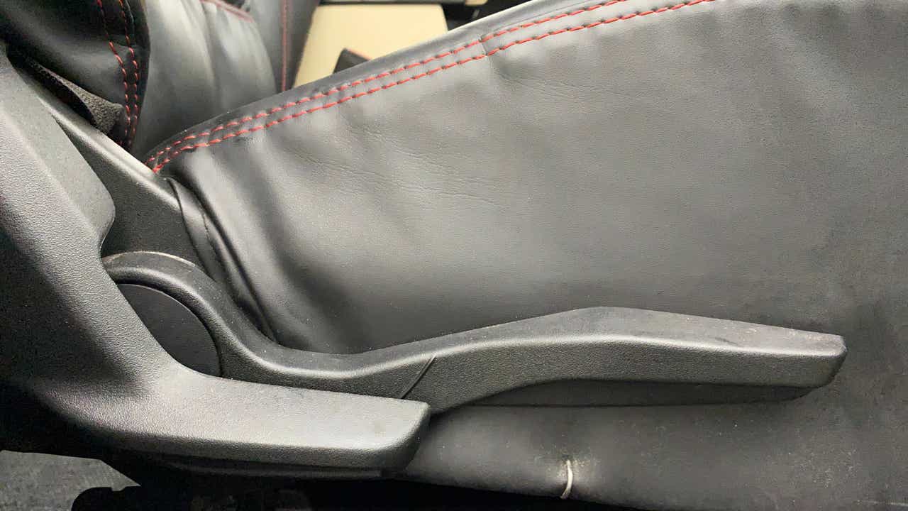 Seat height adjuster lever of a Maruti Suzuki Swift