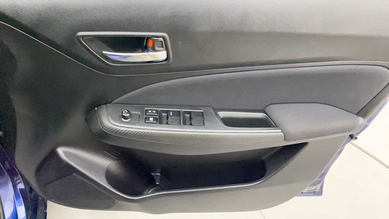 Interior driver side door panel of a Maruti Suzuki Swift 2021 - 2023