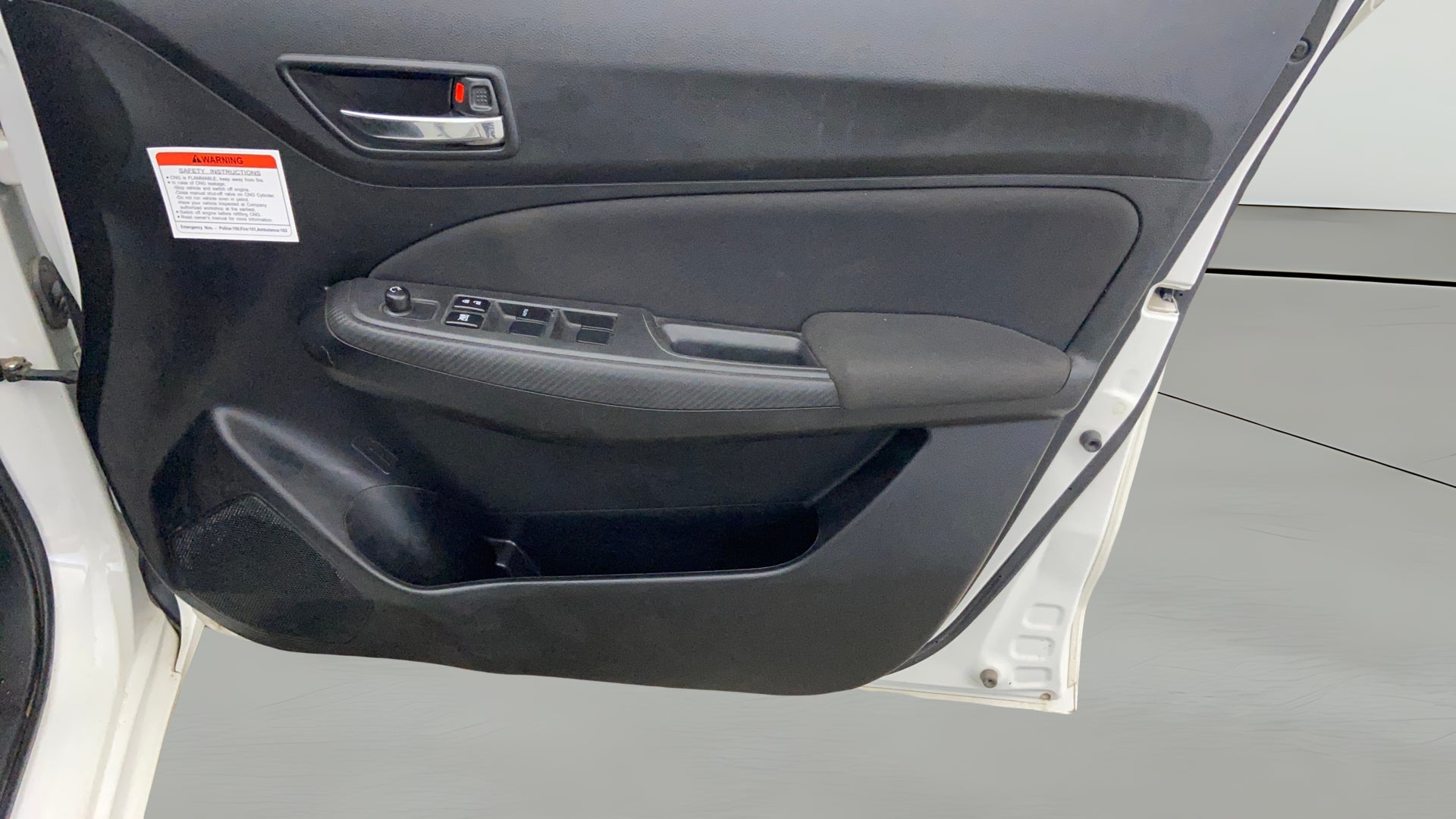 Driver side door panel of a Maruti Suzuki Swift