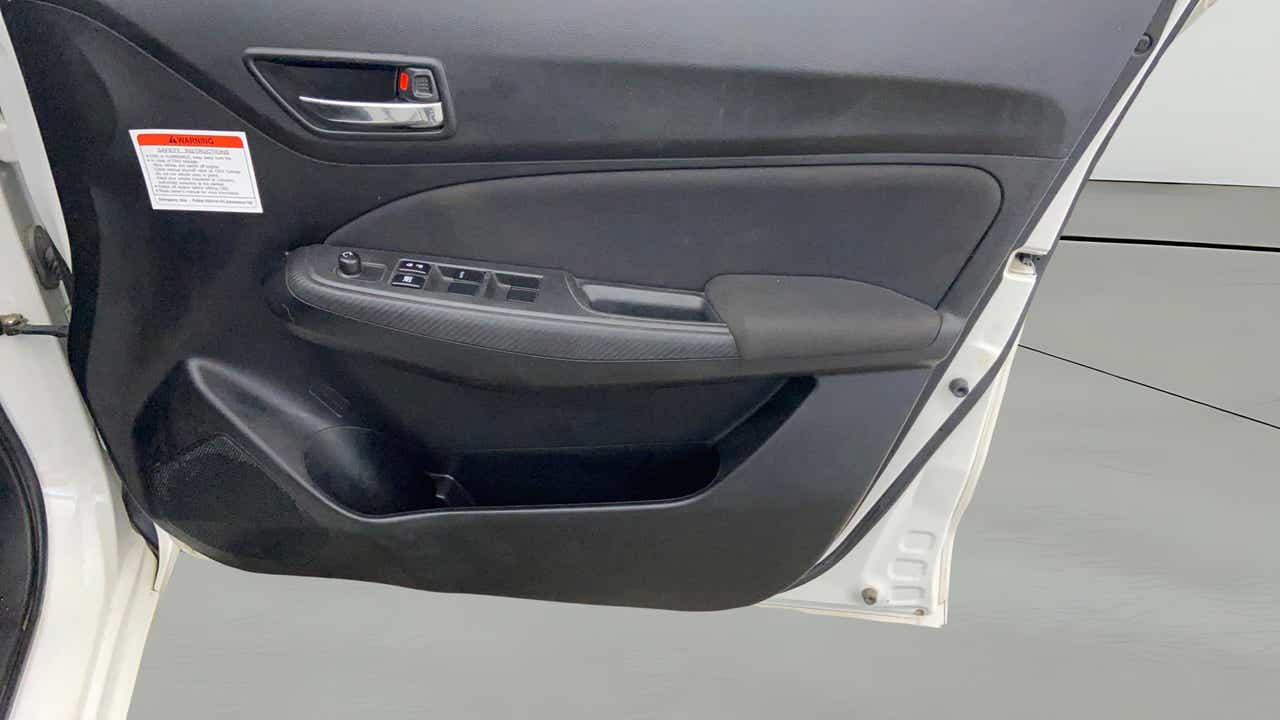 Driver side door panel of a Maruti Suzuki Swift