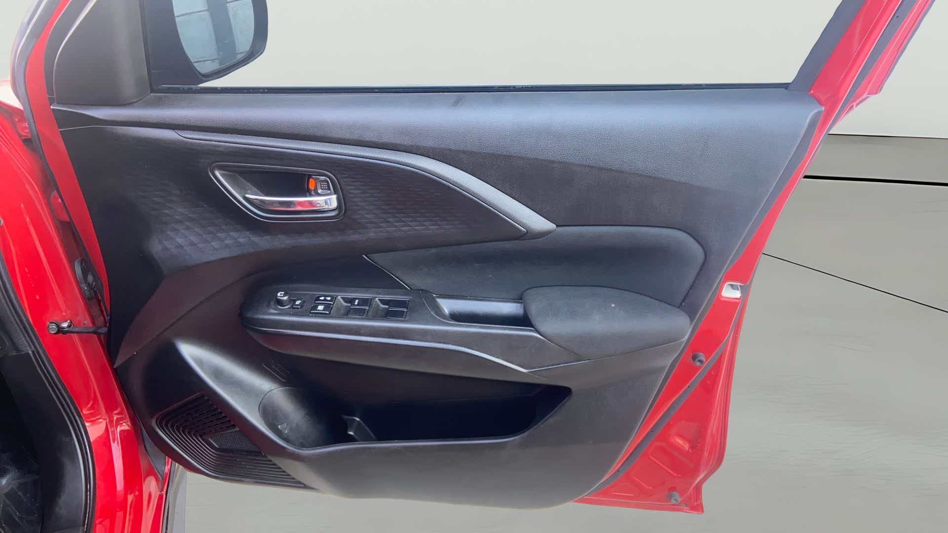 Front driver-side door panel of a Maruti Suzuki Swift