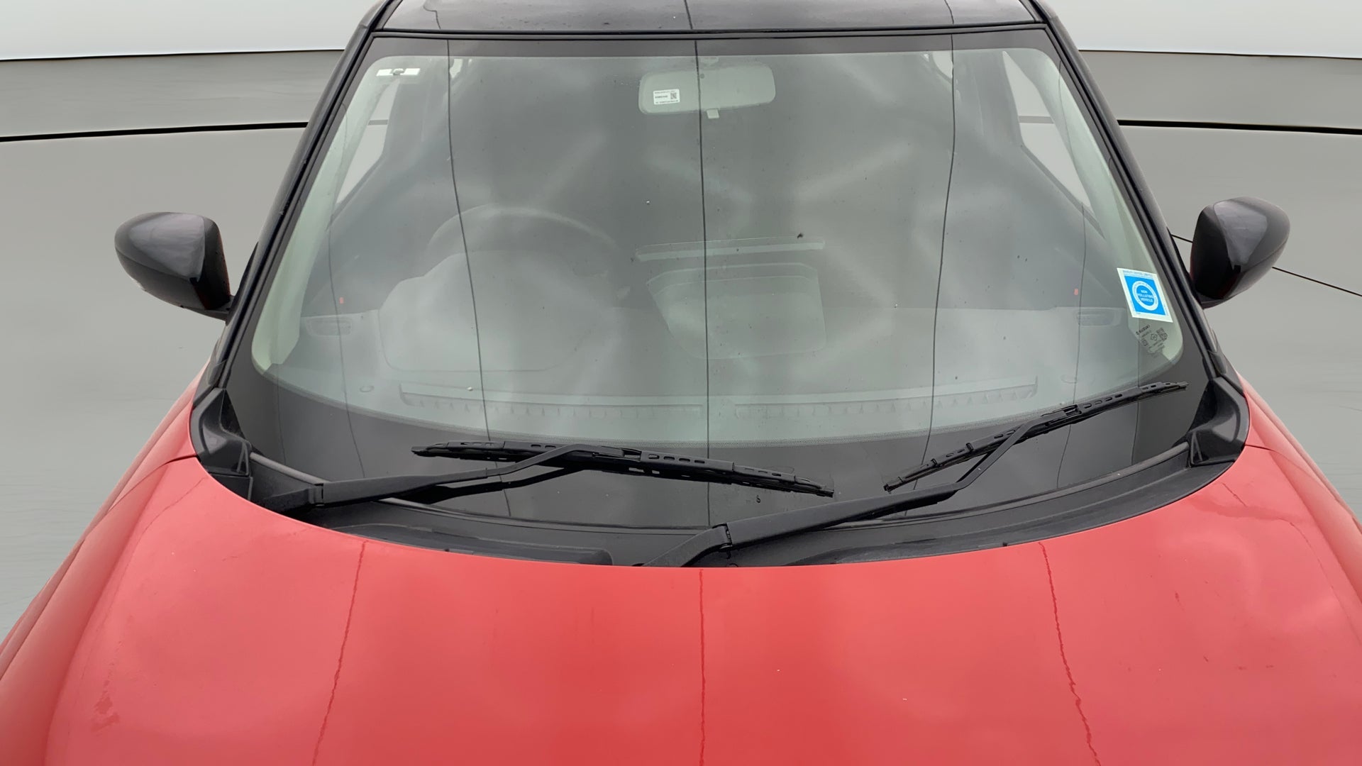 Front windshield and wipers of a Maruti Suzuki Swift