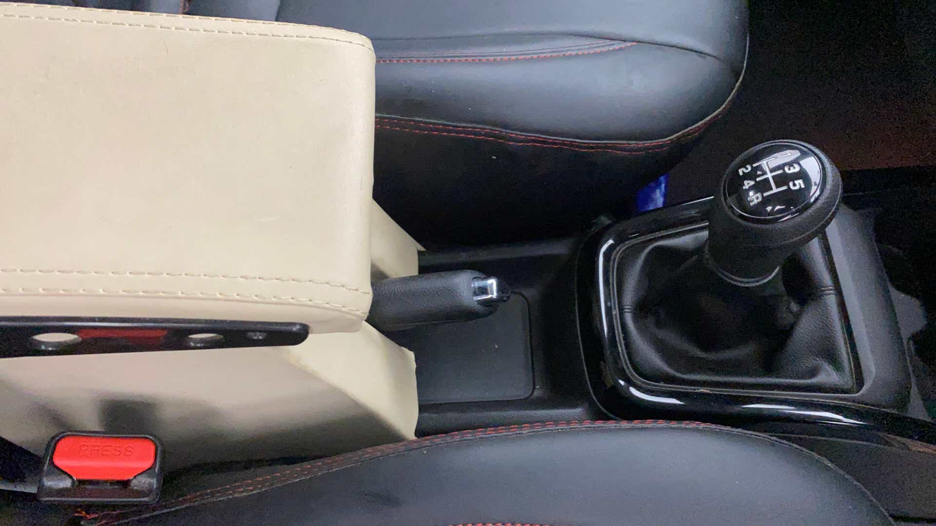 Center console gear shifter and handbrake of a Maruti Suzuki Swift