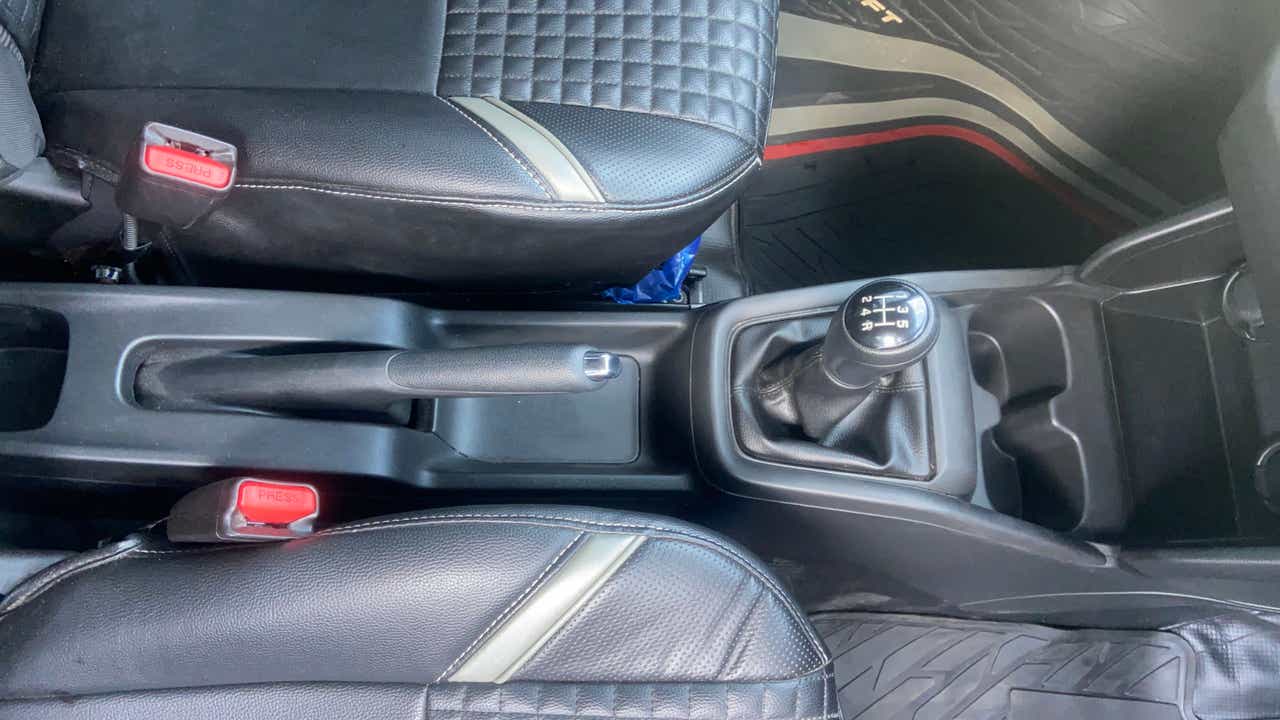 Center console with gear shifter of a Maruti Suzuki Swift