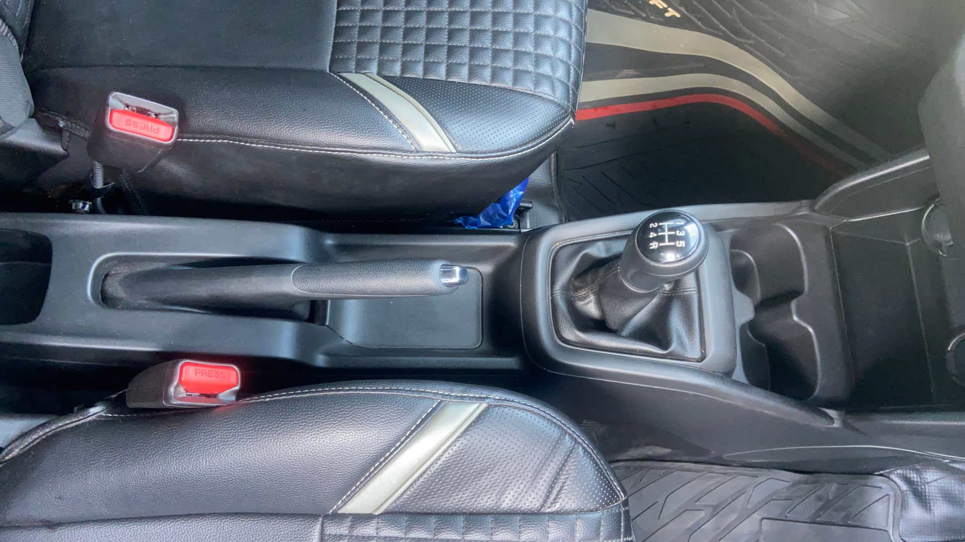 Center console with gear shifter of a Maruti Suzuki Swift