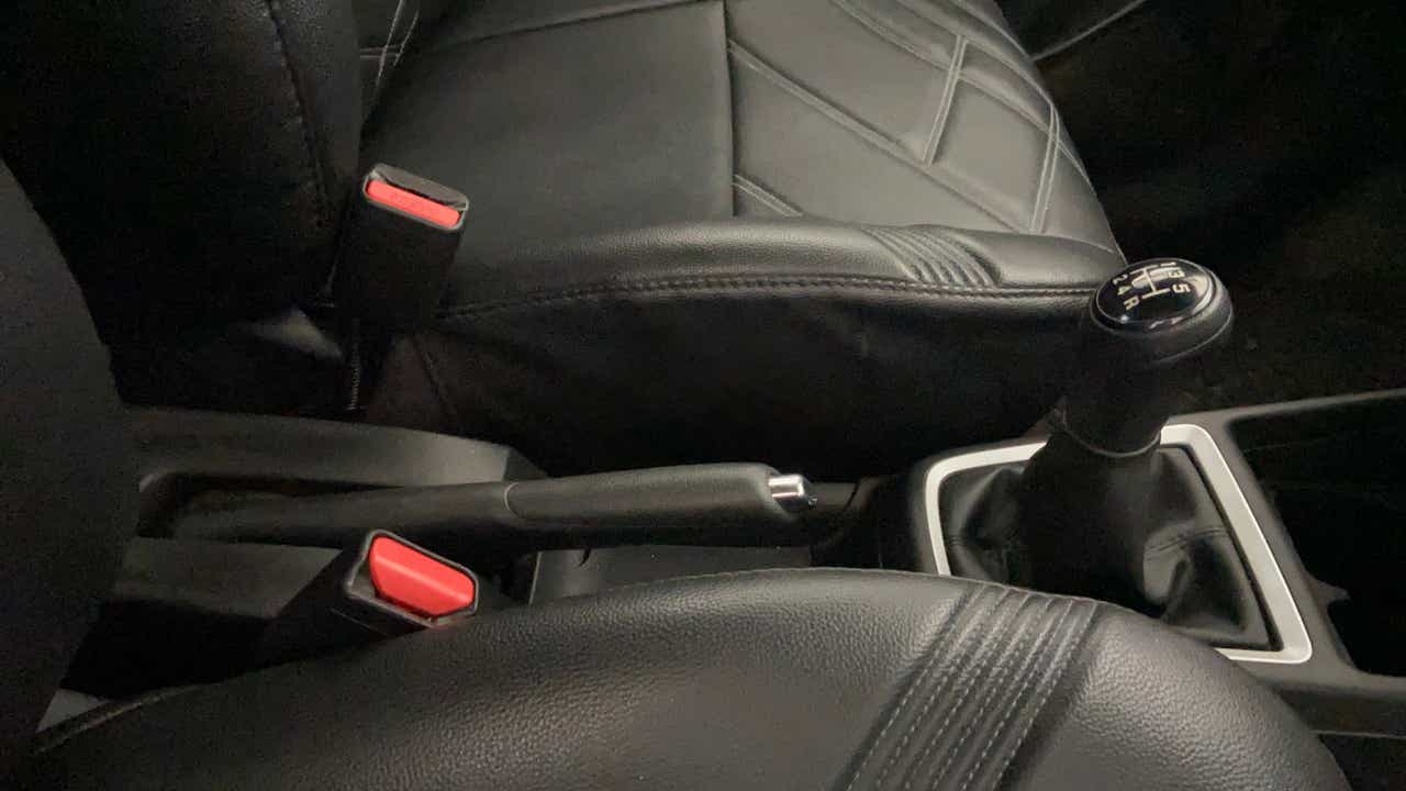 Gear shifter and handbrake area of a Maruti Suzuki Swift