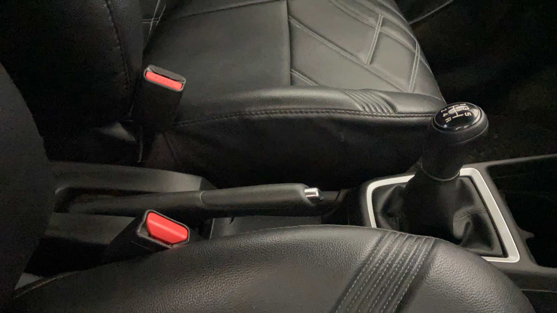 Gear shifter and handbrake area of a Maruti Suzuki Swift