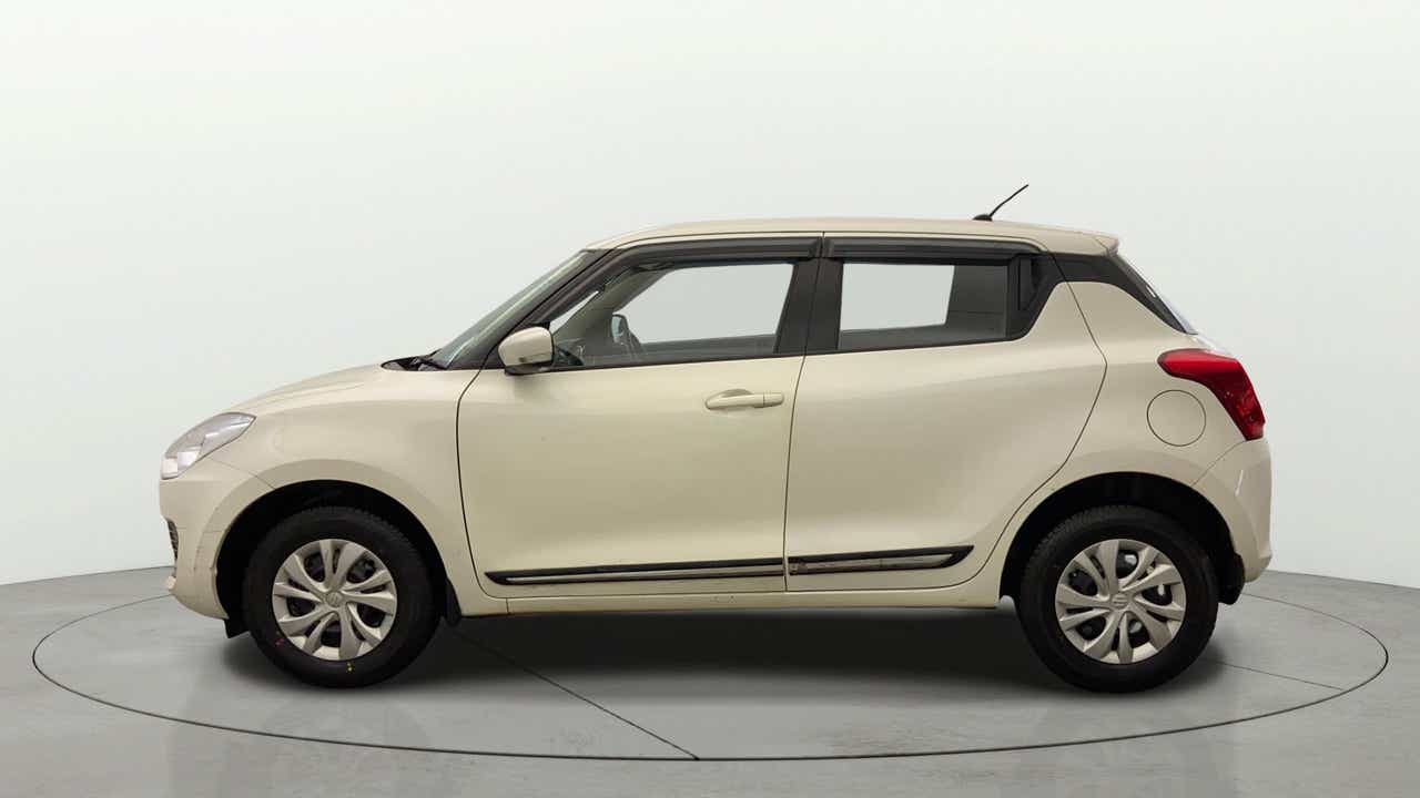 Side view of a Pearl Arctic White with Pearl Midnight Black Maruti Suzuki Swift