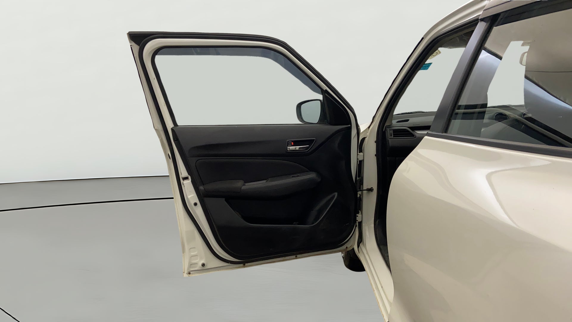 Front left door interior of a Maruti Suzuki Swift